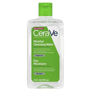 A woman gently wiping off makeup with a cotton pad soaked in CeraVe Micellar Water