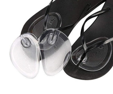 Black flip-flops with clear sandal inserts on a white background