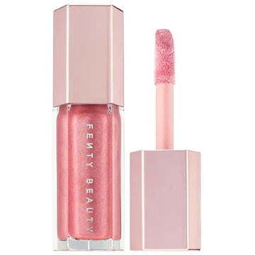 "Fenty Glow Universal Lip Gloss with Warm Coral Shade and Pearly Finish"