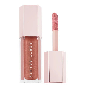 "Fenty Glow Lip Gloss with Warm Coral Shade and Pearly Shine"