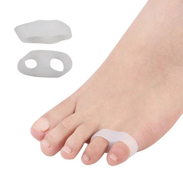 Bunion correctors on a foot with a white background