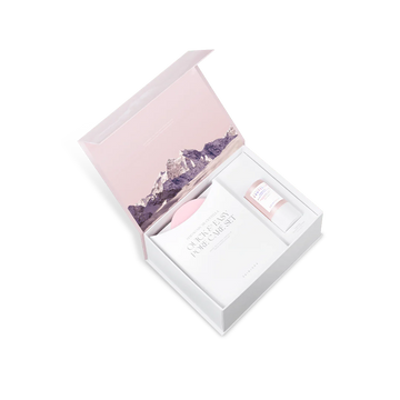 Gift set with a pink box and purple floral design on a white background