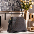 Buy Coach Hanna Shoulder In Signature Canvas Small Bag - Gold Brown Black in Pakistan