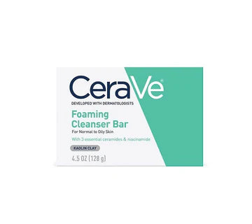 CeraVe Foaming Cleanser Bar with packaging – placed beside clean towels on a bathroom counter

