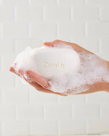 CeraVe Foaming Cleanser Bar with packaging – placed beside clean towels on a bathroom counter

