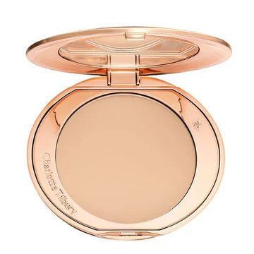 Refillable pressed powder compact opened to reveal ultra-fine product texture

