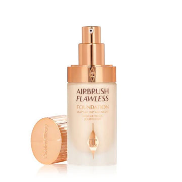 Charlotte Tilbury Airbrush Flawless Foundation bottle displayed elegantly on a marble surface

