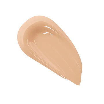 Foundation bottle with matte finish packaging placed beside a makeup brush

