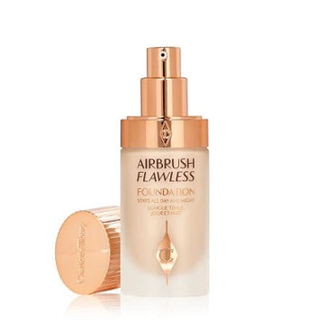 Foundation swatched on different skin tones showing shade 5 Warm

