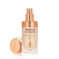 Foundation swatched on different skin tones showing shade 5 Warm

