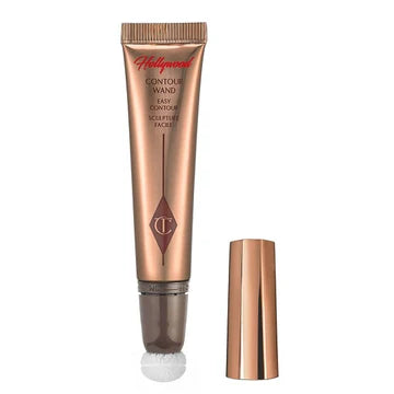 Hollywood Contour Wand with cushion applicator placed on vanity with makeup tools

