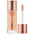 Model applying product to cheekbones, highlighting the dewy, luminous finish

