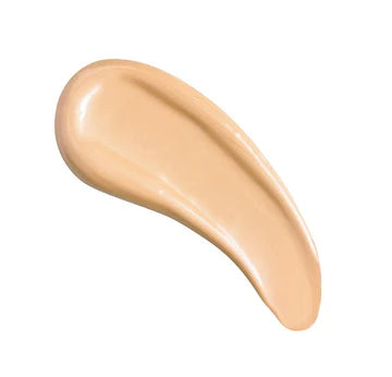 Model applying glow booster to cheekbones and forehead for a dewy highlight

