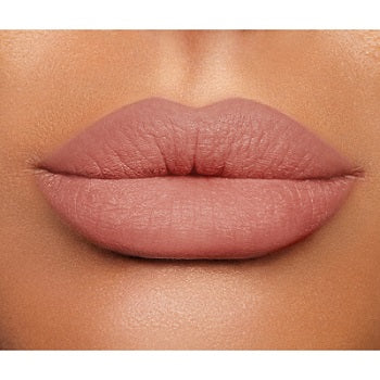 Charlotte Tilbury Lip Cheat Lip Liner displayed with cap off, showing fine pencil tip in a nude pink shade

