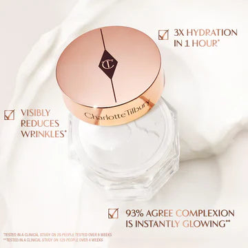 Model applying Magic Cream to cheeks for an instant glow

