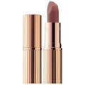 Charlotte Tilbury Matte Lipstick in signature packaging on a soft pink background


