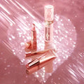 Close-up of lips wearing the Pillow Talk Plumpgasm gloss with high-shine finish

