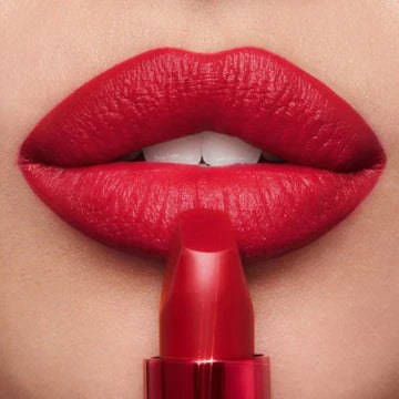 Charlotte Tilbury Matte Lipstick in rosewood nude shade displayed with signature packaging


