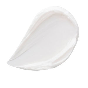 Close-up texture of the Magic Cream being scooped from the jar with a finger

