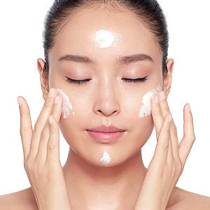 Product styled with luxury skincare tools and soft lighting


