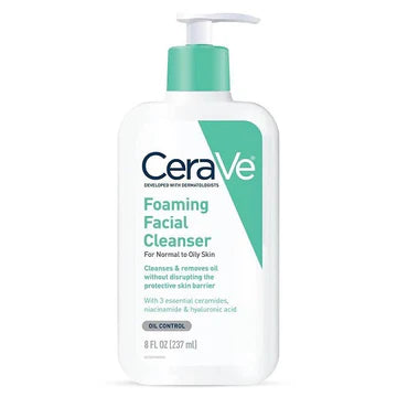 CeraVe Foaming Facial Cleanser bottle placed next to a fresh towel and water drops, highlighting its clean and minimal design.