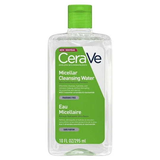 A woman gently wiping off makeup with a cotton pad soaked in CeraVe Micellar Water

