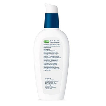 CeraVe PM Facial Moisturizing Lotion bottle placed on a nightstand next to a lamp and a glass of water, representing nighttime skincare