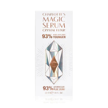 Charlotte Tilbury brightening and firming serum in gold-accented packaging on a vanity table

