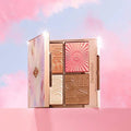 Charlotte Tilbury face palette with 4 glowing pans of highlight, blush, bronzer, and multi-glow shades


