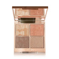 Close-up swatches of the face palette on medium skin showing glow and contour payoff

