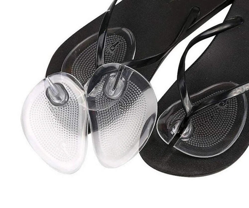 Black flip-flops with clear sandal inserts on a white background