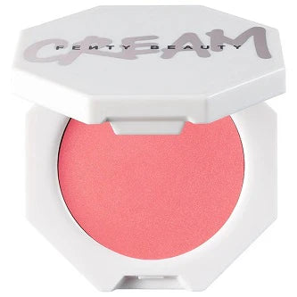 Model applying the cream blush, showing a natural, radiant flush on cheeks.

