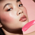 Swatch of soft pink cream blush showing smooth, blendable texture on skin.

