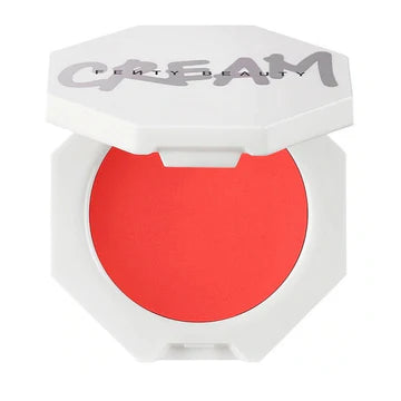 A model applying the cream blush to her cheeks, demonstrating a natural, radiant flush.

