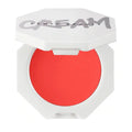 A model applying the cream blush to her cheeks, demonstrating a natural, radiant flush.

