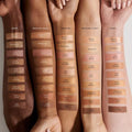 Highlighter swatch on various skin tones showing soft, natural glow.