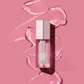 Close-up of a lip gloss applicator with a glossy shine on the wand.

