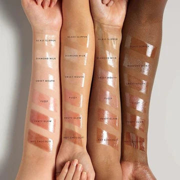 Swatches of six glossy shades on different skin tones