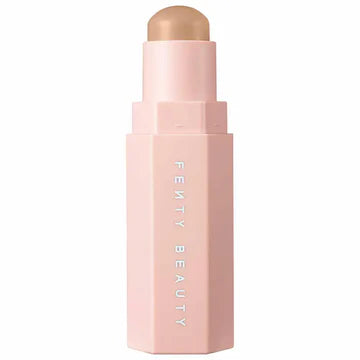 A flat lay of the matte contour stick along with other makeup essentials, creating a chic beauty aesthetic.

