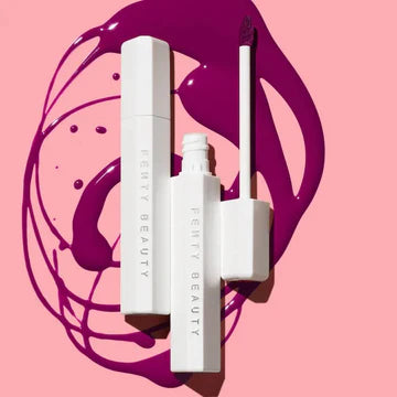 A close-up of the lip stain bottle with a vibrant shade, highlighting the glossy texture.

