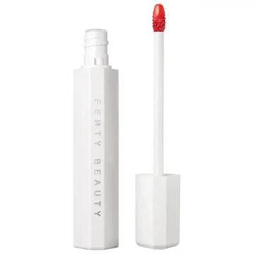 Glossy lip stain applicator with a vibrant color swatch, showcasing a hydrating finish.

