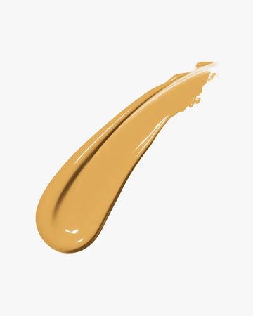  Application of foundation on face showing smooth, natural finish