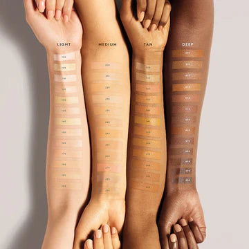 Close-up of a liquid concealer applicator with a creamy, smooth formula, perfect for full coverage.

