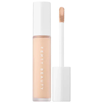 Close-up of a liquid concealer applicator with a creamy, smooth formula, perfect for full coverage.

