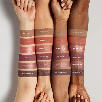 A model wearing the eyeshadow palette, displaying a vibrant eye makeup look with rich, blendable colors.

