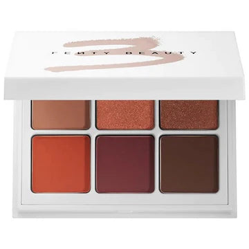 A model wearing the eyeshadow palette, displaying a vibrant eye makeup look with rich, blendable colors.

