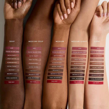 Swatches of creamy lip liner shades on different skin tones.