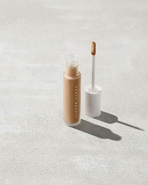 Swatches of 50 concealer shades on different skin tones.