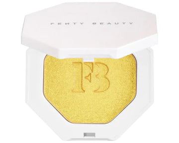 Close-up of cream-powder highlighter compact with a radiant shimmer finish.

