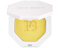 Close-up of cream-powder highlighter compact with a radiant shimmer finish.

